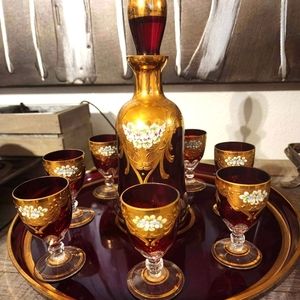 Czech ruby glass, cut and beveled with gold andbornate floral.